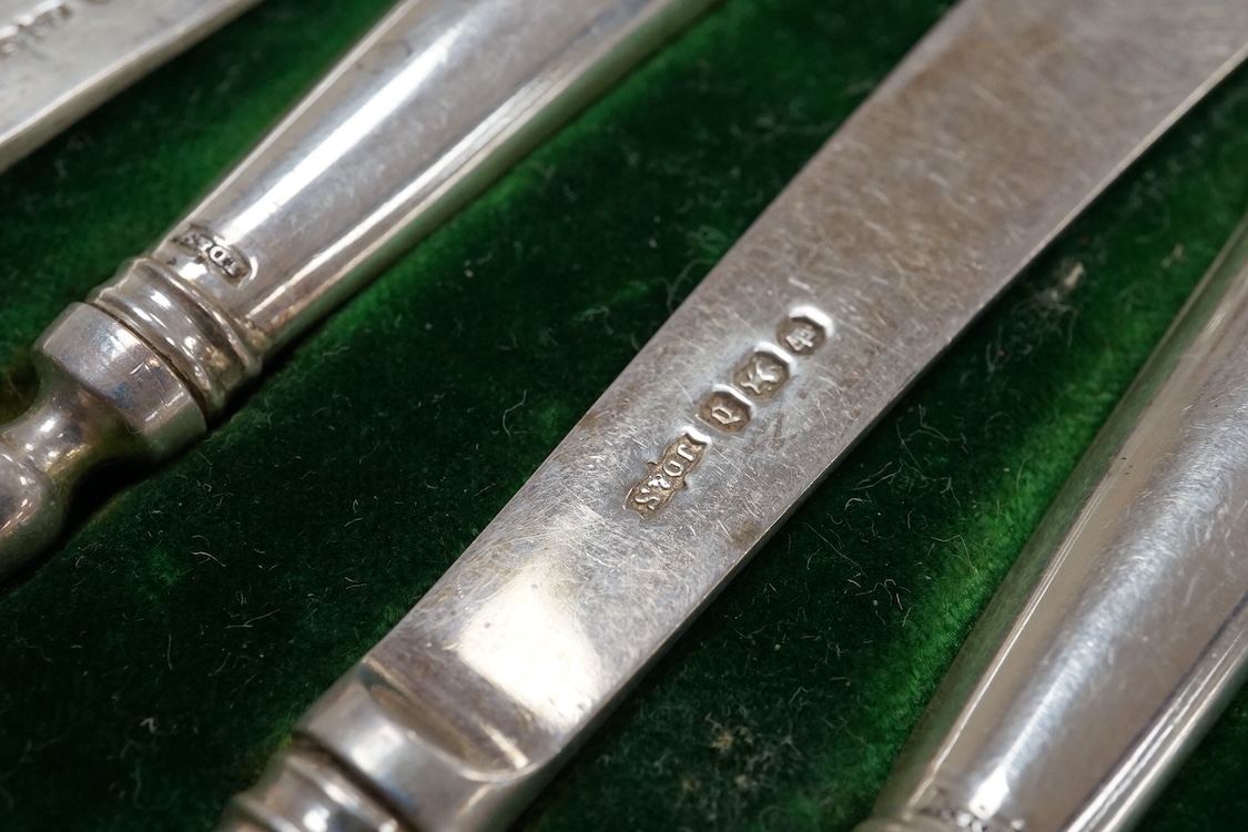 A cased set of six pairs of silver pistol handled dessert eaters by James Dixon & Sons, Sheffield, 1896, loaded, (a.f.), together with a small quantity of assorted silver flatware, 10oz.